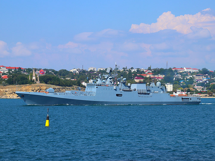 Frigate Admiral Makarov on the background of the North side of Sevastopol